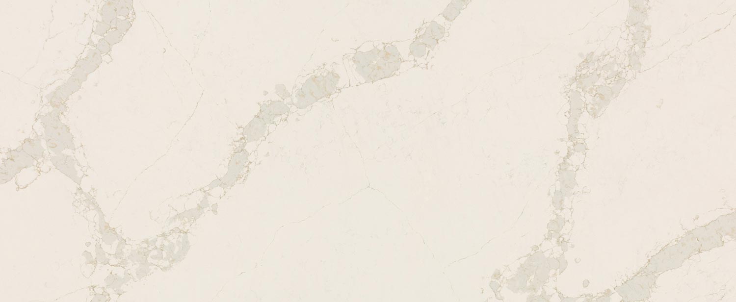 Caesarstone Quartz 5116 Calacatta Nectar countertops in warm white with bold golden-grey patterns, ideal for kitchen countertops. Caesarstone quartz by Granite Guy Inc.