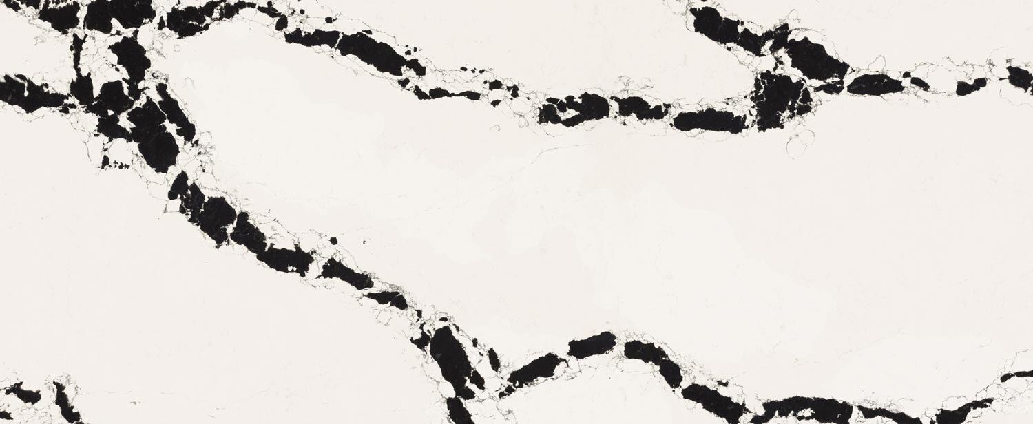 Caesarstone Quartz 5118 Calacatta Scoria countertops in white with bold black patterns, perfect for kitchen countertops. Caesarstone quartz by Granite Guy Inc.