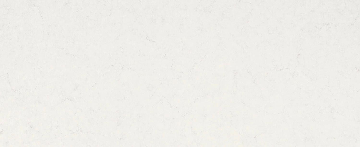 Caesarstone Quartz 5141 Frosty Carrina countertops in creamy white with soft marbling, ideal for kitchen countertops. Caesarstone quartz by Granite Guy Inc.