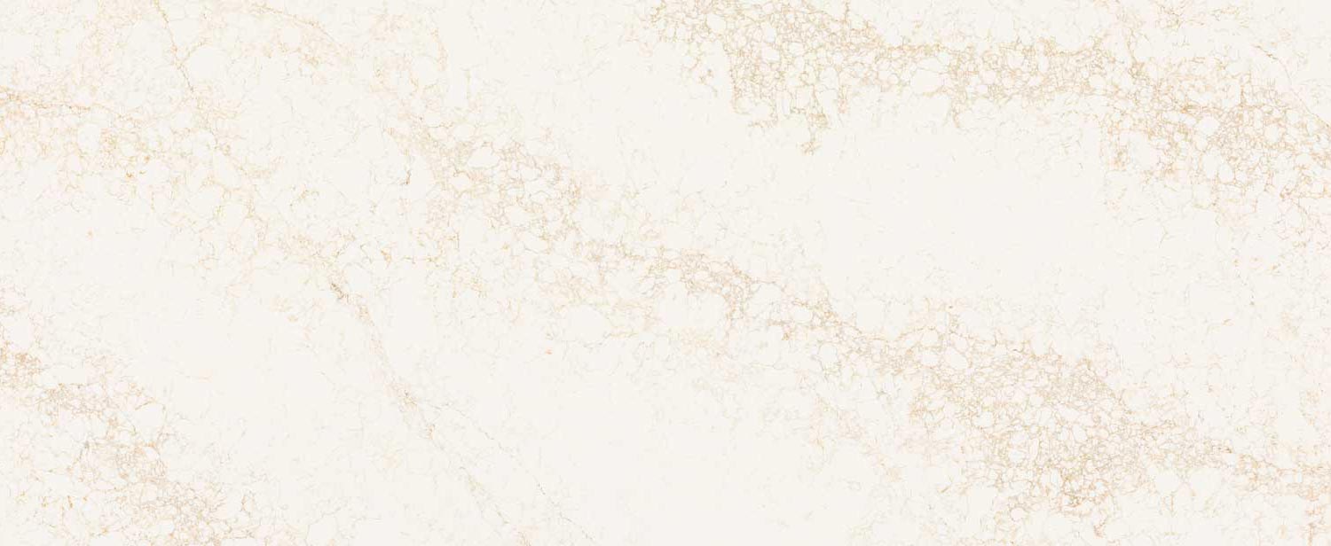 Caesarstone Quartz 5152 Goldfinch countertops in creamy white with soft golden marbling, ideal for kitchen countertops. Caesarstone quartz by Granite Guy Inc.