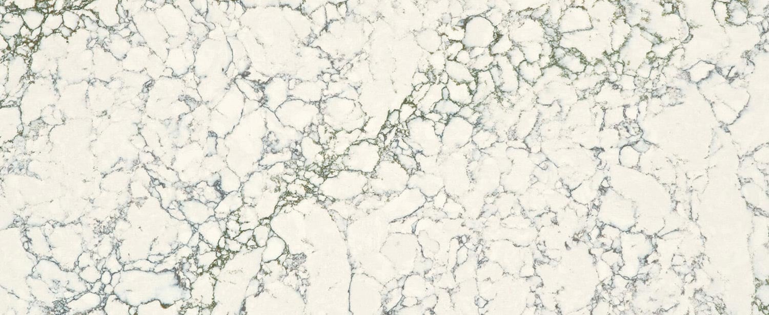 Caesarstone Quartz 5171 Arabetto countertops in white with intricate dark and green veining, ideal for kitchen countertops. Caesarstone quartz by Granite Guy Inc.