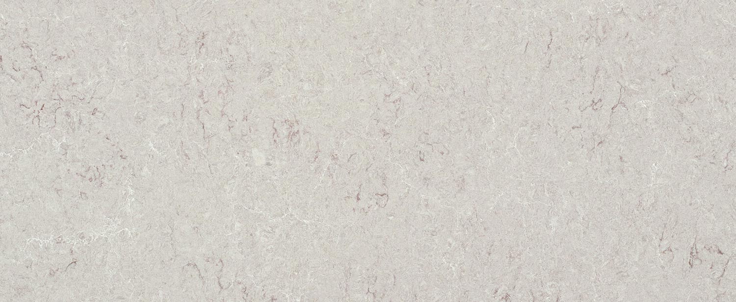 Caesarstone Quartz 6131 Bianco Drift countertops in a soft beige-gray tone, ideal for kitchen countertops. Caesarstone quartz by Granite Guy Inc.
