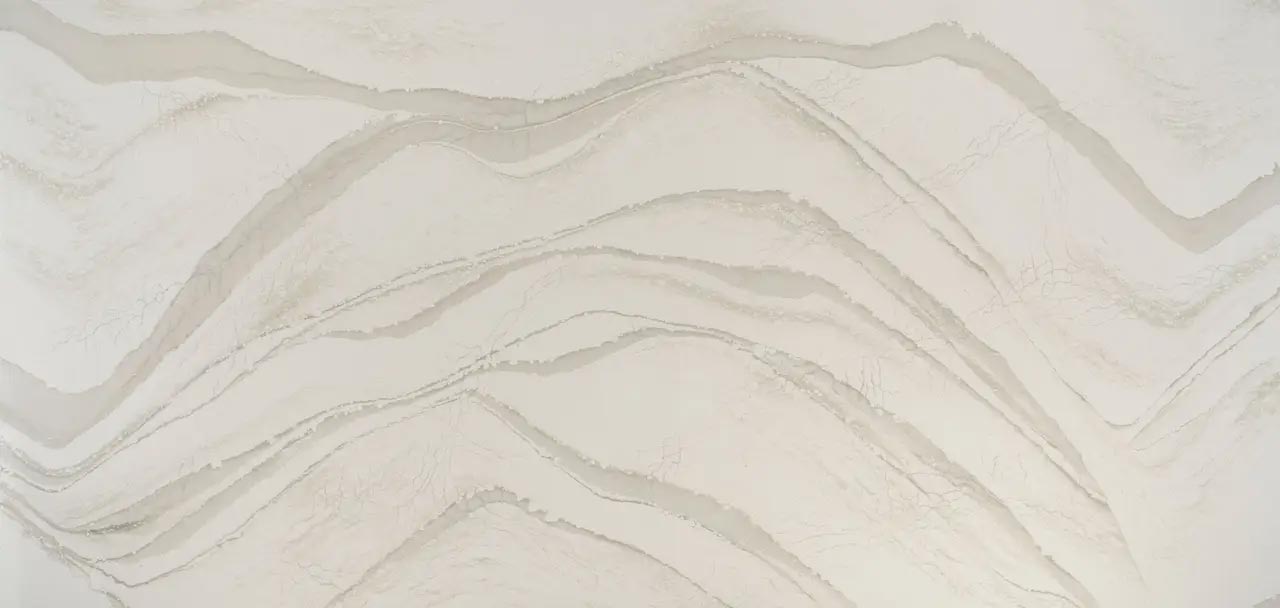 Cambria Quartz Brittanicca Warm countertops with flowing warm veining, perfect for kitchen countertops by Granite Guy Inc.
