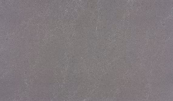 One Quartz Armor Grey countertops in a soft gray tone with subtle specks, ideal for kitchen countertops. One Quartz by Granite Guy Inc.