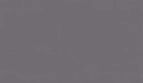 One Quartz Brushed Flannel countertops in a soft gray-beige tone with gentle pattern, ideal for kitchen countertops. One Quartz by Granite Guy Inc.