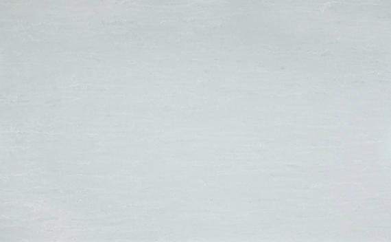 One Quartz Juneau countertops in a cool gray tone with a smooth, cloudy texture, ideal for kitchen countertops. One Quartz by Granite Guy Inc.