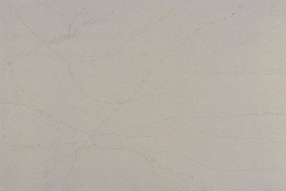 One Quartz Noble Grey countertops in a soft gray base with subtle flowing veining, perfect for kitchen countertops. One Quartz by Granite Guy Inc.