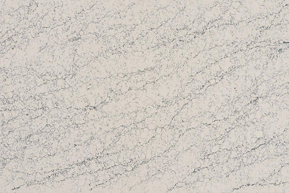 One Quartz Rushmore countertops in a creamy white base with intricate gray veining, ideal for kitchen countertops. One Quartz by Granite Guy Inc.