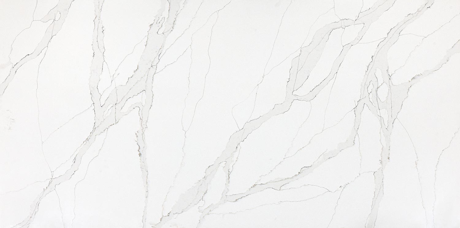 Vadara Quartz Aurora Frost countertops with soft gray veining and a clean white base, perfect for kitchen countertops. Vadara quartz by Granite Guy Inc.