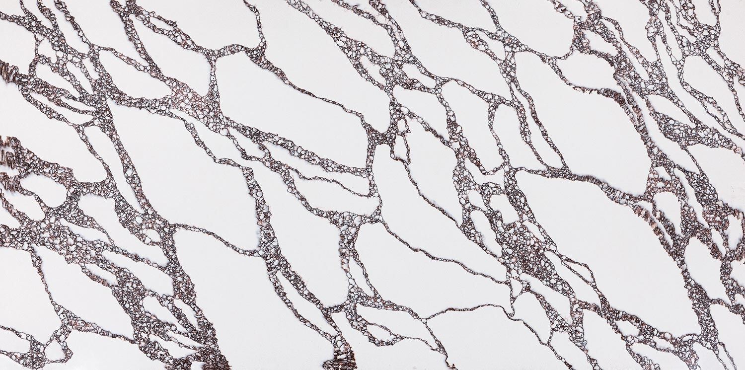 Vadara Quartz Crimson Peak countertops with dramatic crimson patterns, ideal for kitchen countertops. Vadara quartz by Granite Guy Inc.