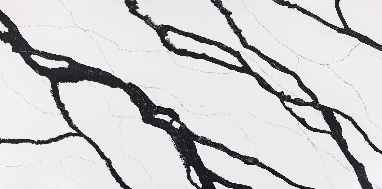 Vadara Quartz Lava Plain countertops with bold black veining on white, ideal for kitchen countertops. Vadara quartz by Granite Guy Inc.