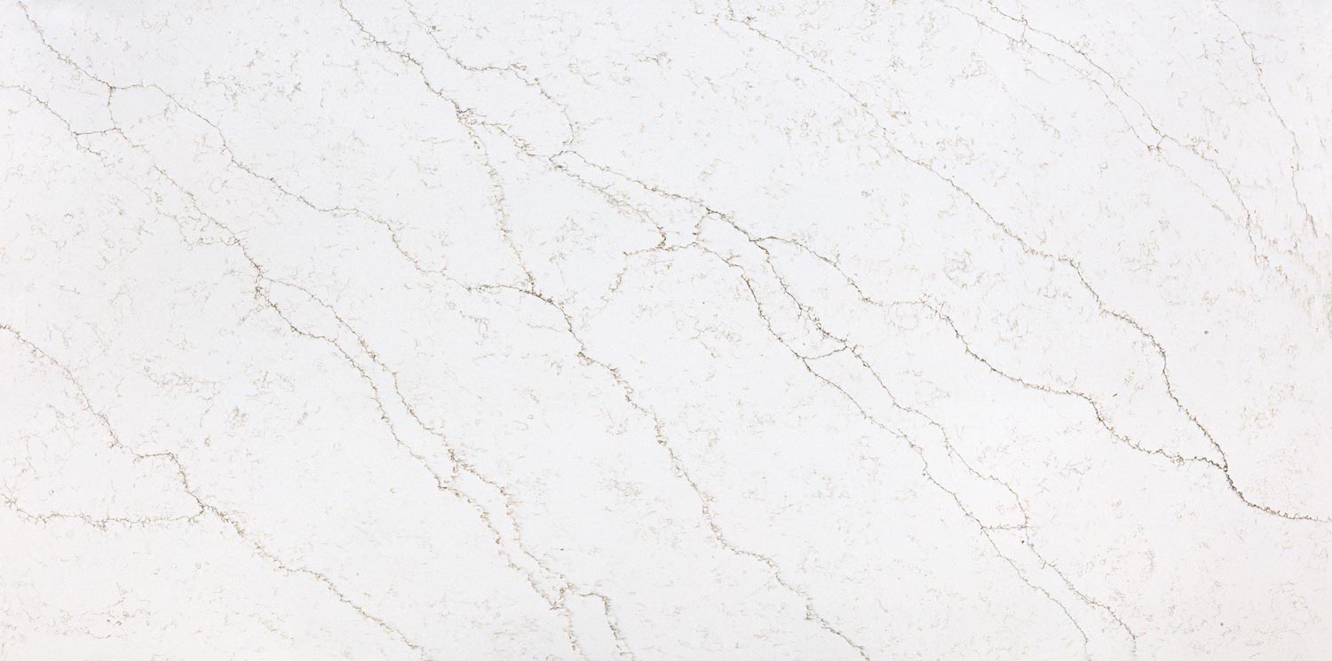 Vadara Quartz Naurelle countertops with light taupe veining, a warm choice for kitchen countertops. Vadara quartz by Granite Guy Inc.