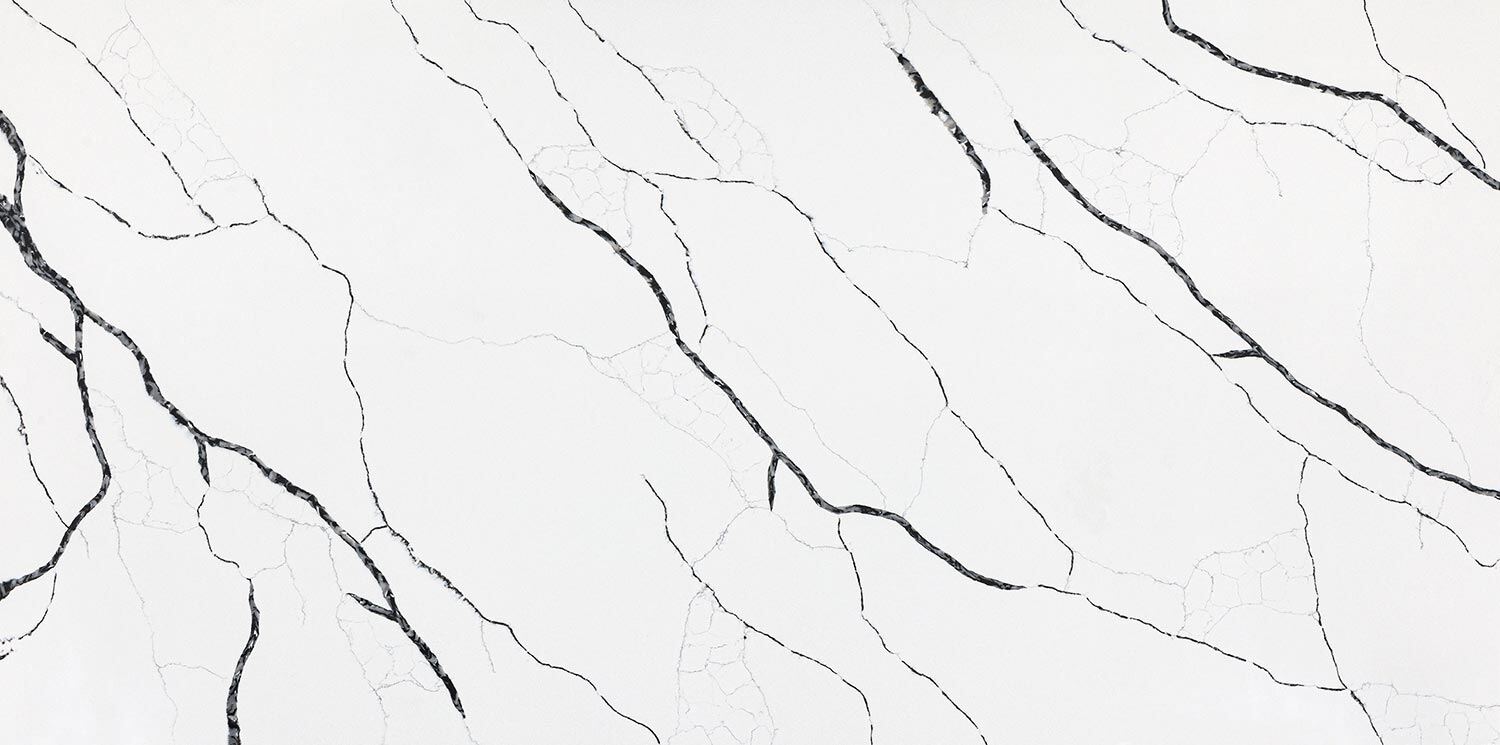 Vadara Quartz NordicStorm countertops with bold black veining and subtle crackle accents, great for kitchen countertops. Vadara quartz by Granite Guy Inc.