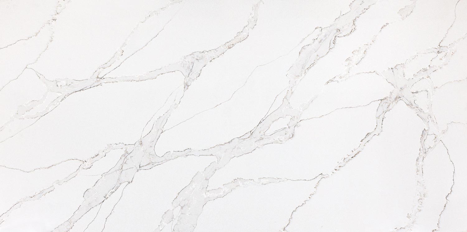 Vadara Quartz Phoenix Sky countertops with soft white background and subtle gray pattern. Kitchen countertops. Vadara quartz by Granite Guy Inc.