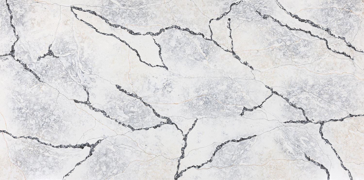 Vadara Quartz Sakura countertops with bold black crackled veining over a cloudy gray background, perfect for kitchen countertops. Vadara quartz by Granite Guy Inc.