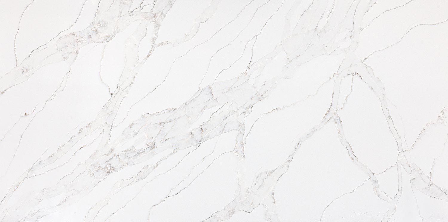 Vadara Quartz Sterling Light countertops with soft white base and layered gray movement. Kitchen countertops. Vadara quartz by Granite Guy Inc.