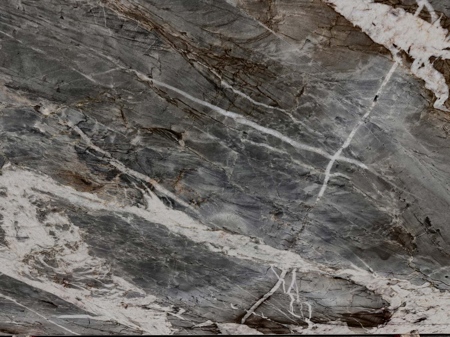 Adara Crystal quartzite countertops with striking gray, white, and gold veining, ideal for luxury kitchen countertops by Granite Guy Inc.