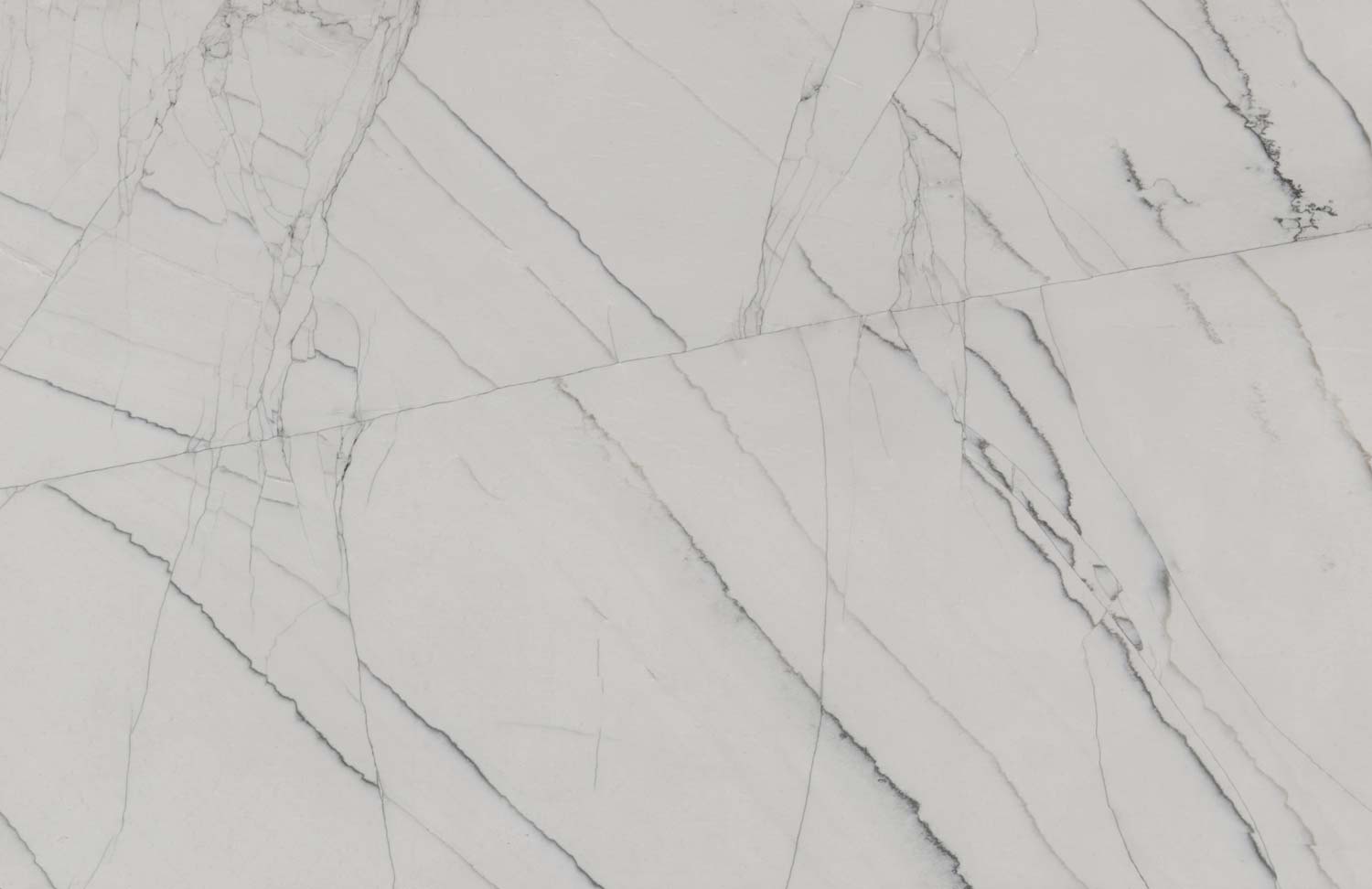 Bianco Supreme quartzite countertops with a bright white base and soft gray veining, perfect for kitchen countertops by Granite Guy Inc.
