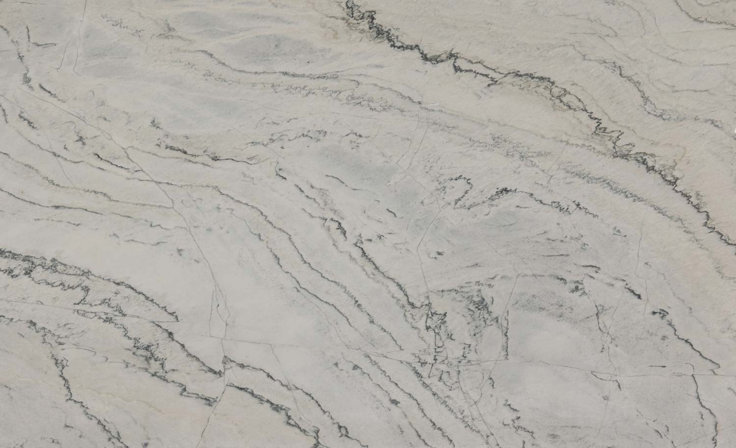 Calacatta quartzite countertops with bold gray veining, ideal for kitchen countertops and statement islands by Granite Guy Inc.
