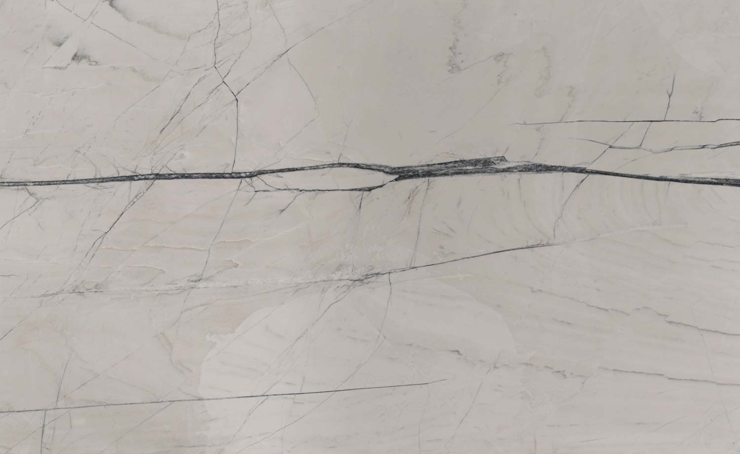 Fantasy Montreal quartzite countertops with a soft beige base and bold dark veins, perfect for kitchen countertops by Granite Guy Inc.