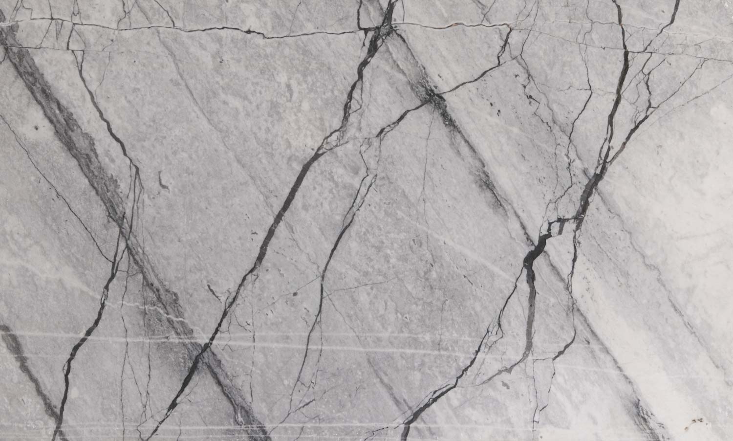 Frozen Grey quartzite countertops with bold dark veining, ideal for kitchen countertops and statement islands by Granite Guy Inc.
