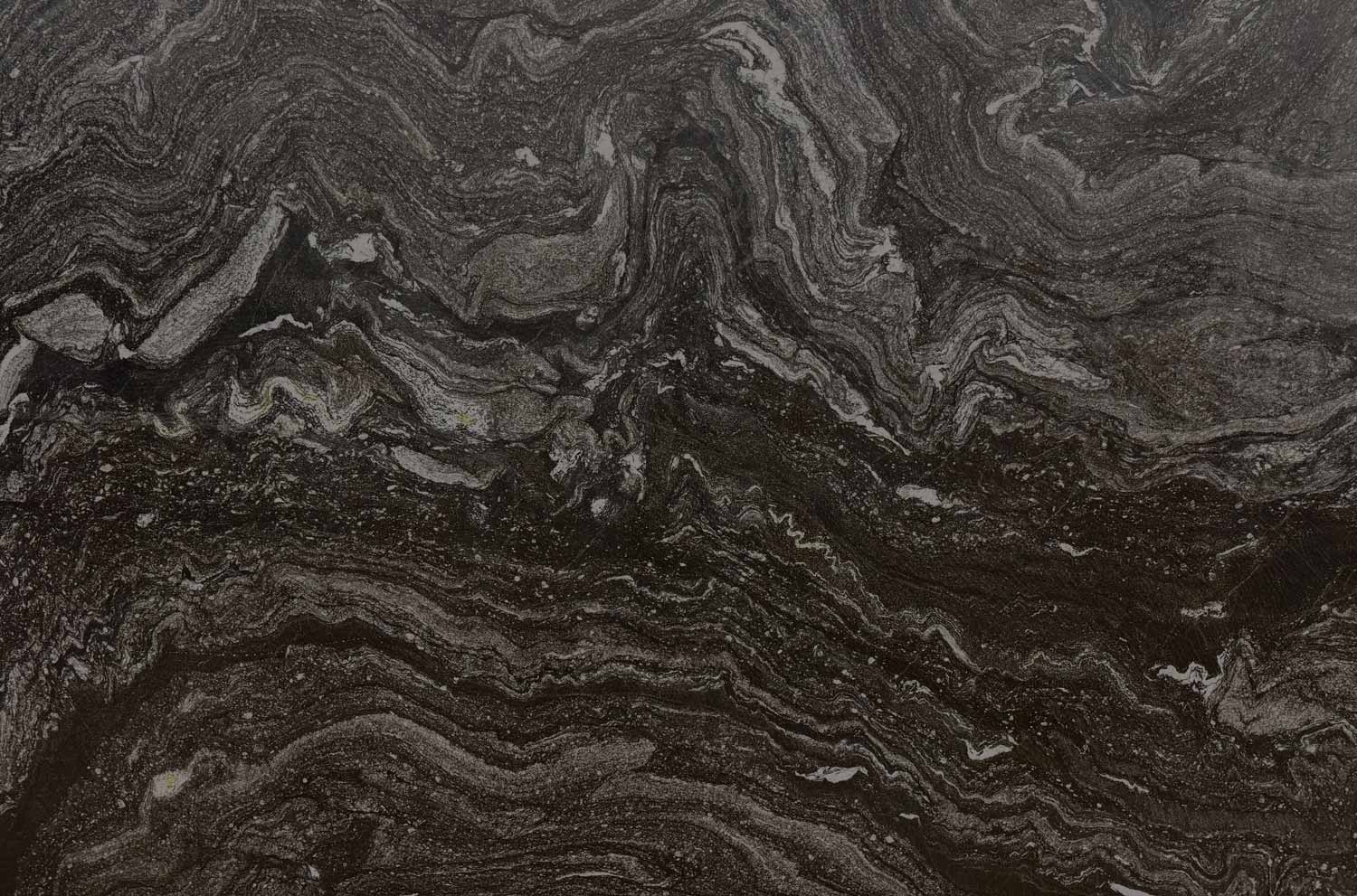 Makaku quartzite countertop featuring bold dark waves and intricate natural patterns, ideal for kitchens, bathrooms, and luxury interiors.