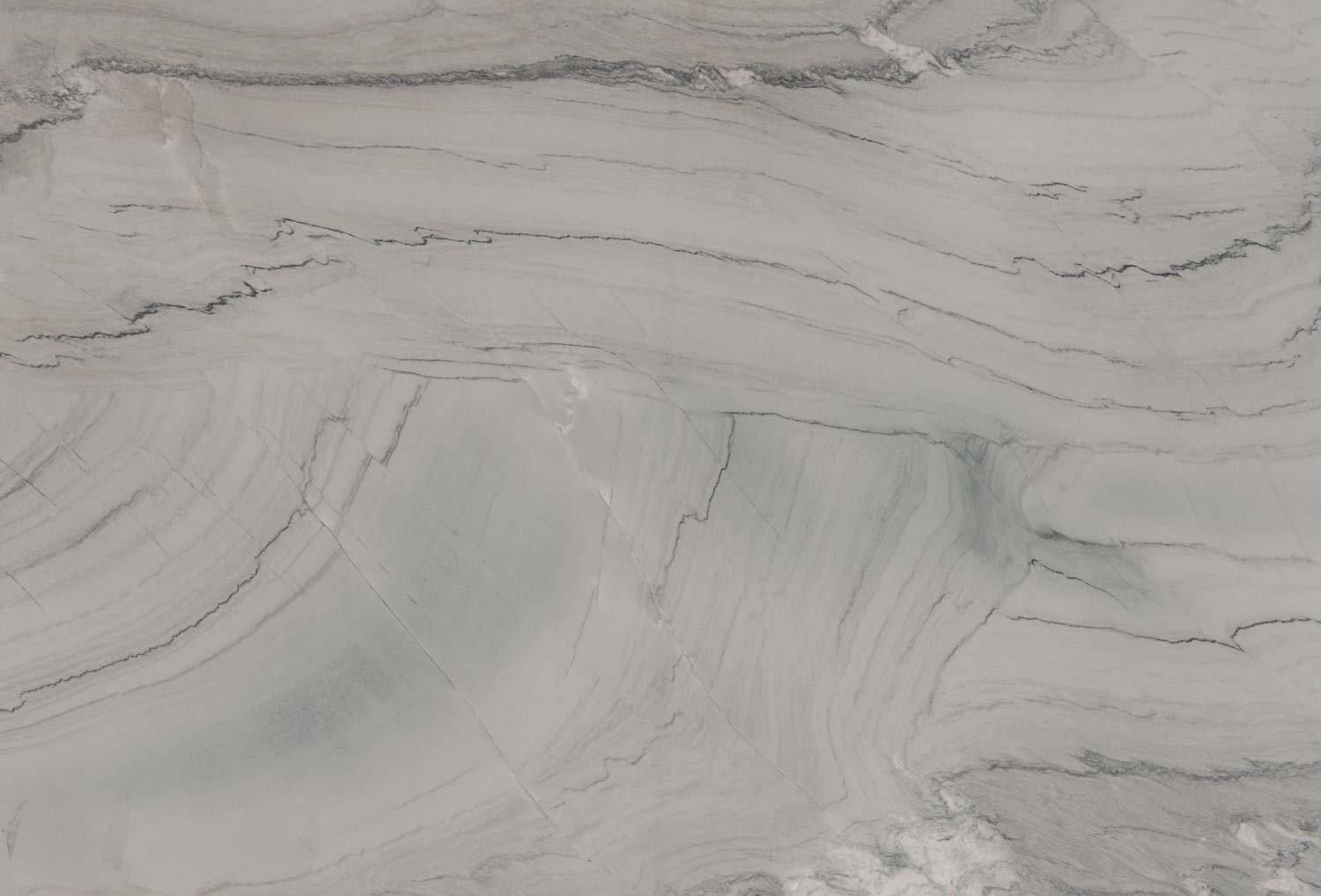 Maya quartzite countertops with flowing gray patterns, ideal for kitchen countertops and statement islands by Granite Guy Inc.