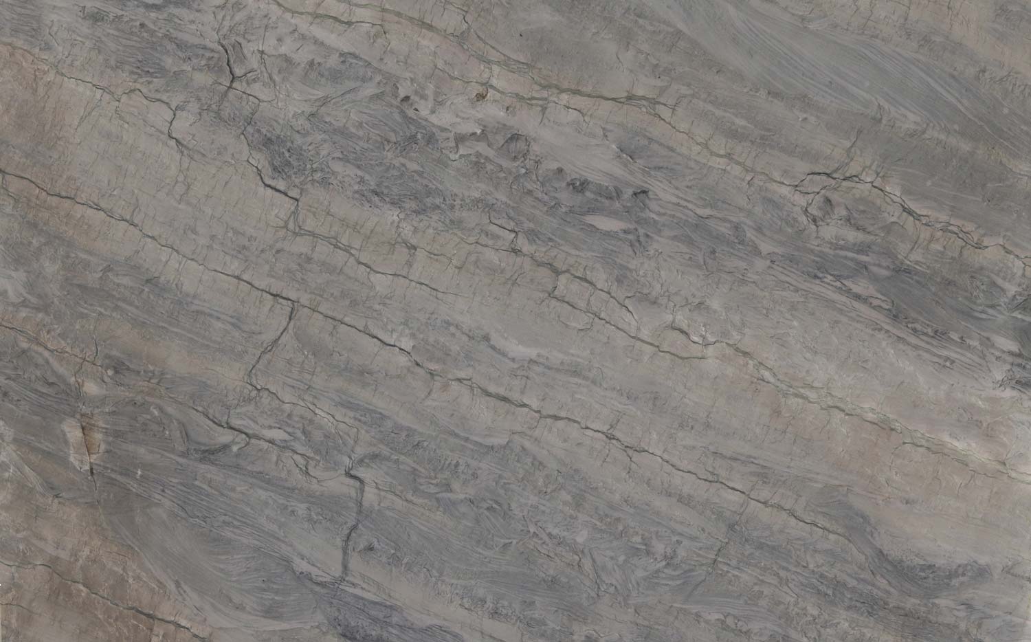 Ocean Blue quartzite countertops with deep blue-gray waves, ideal for kitchen countertops and statement islands by Granite Guy Inc.
