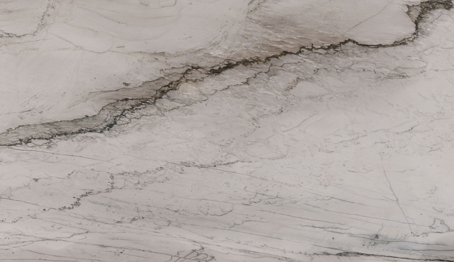 Sea Pearl quartzite countertops with soft white tones and intricate gray veining, perfect for kitchen countertops by Granite Guy Inc.