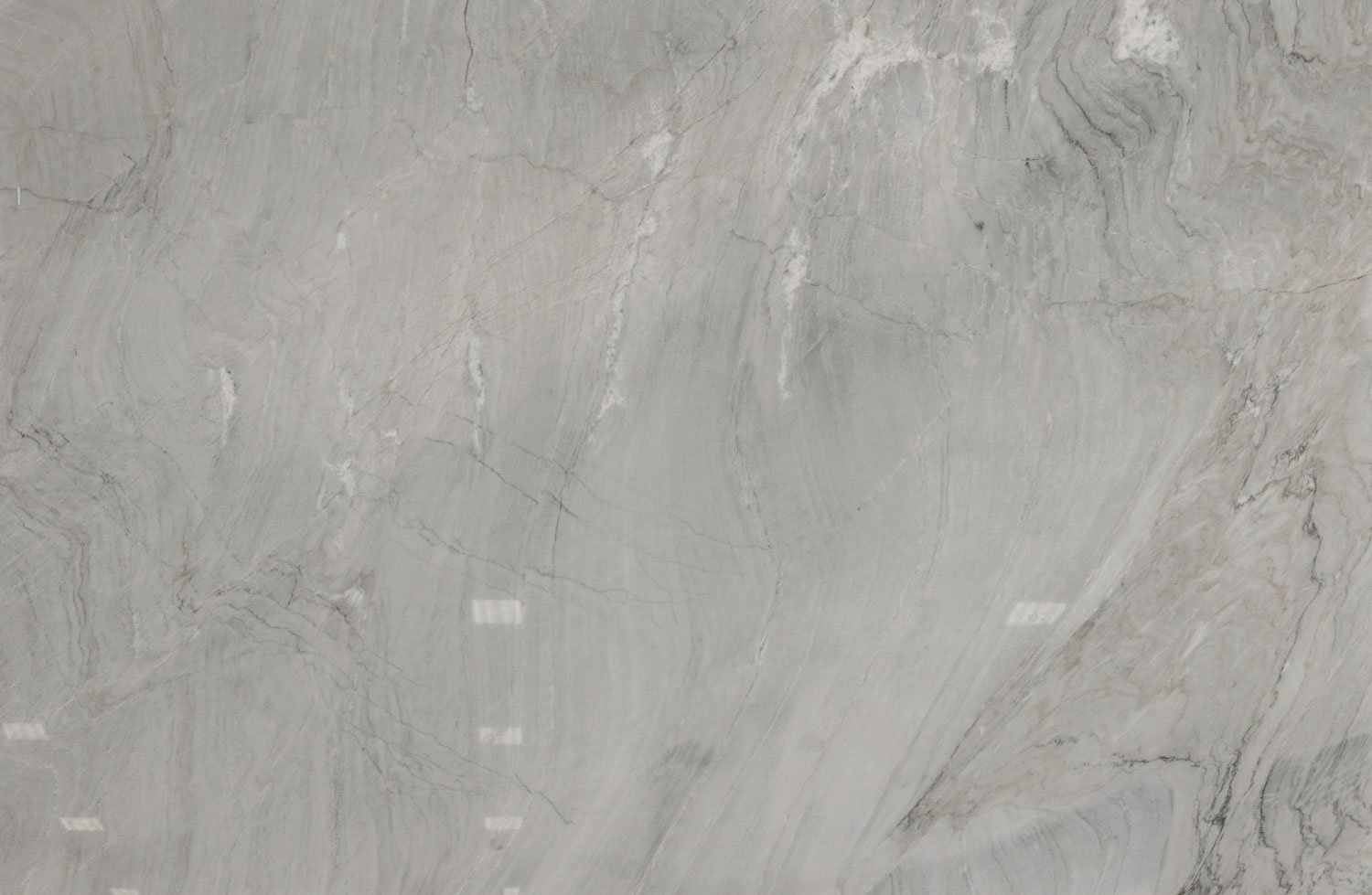 Sette Mari quartzite countertops with soft gray tones and flowing natural veining, perfect for kitchen countertops by Granite Guy Inc.