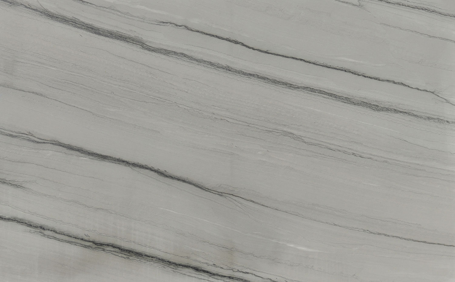 Silver Shadow quartzite countertops with soft gray tones and bold linear veining, perfect for kitchen countertops by Granite Guy Inc.
