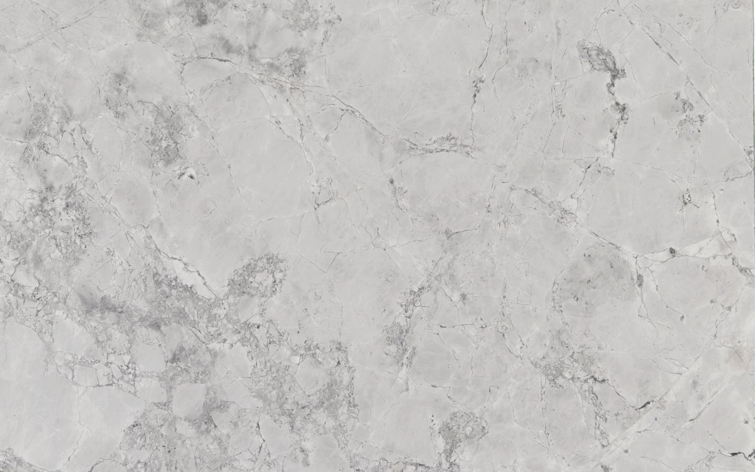Wicked White quartzite countertops with a bright white base and bold black fractured pattern, perfect for kitchen countertops by Granite Guy Inc.
