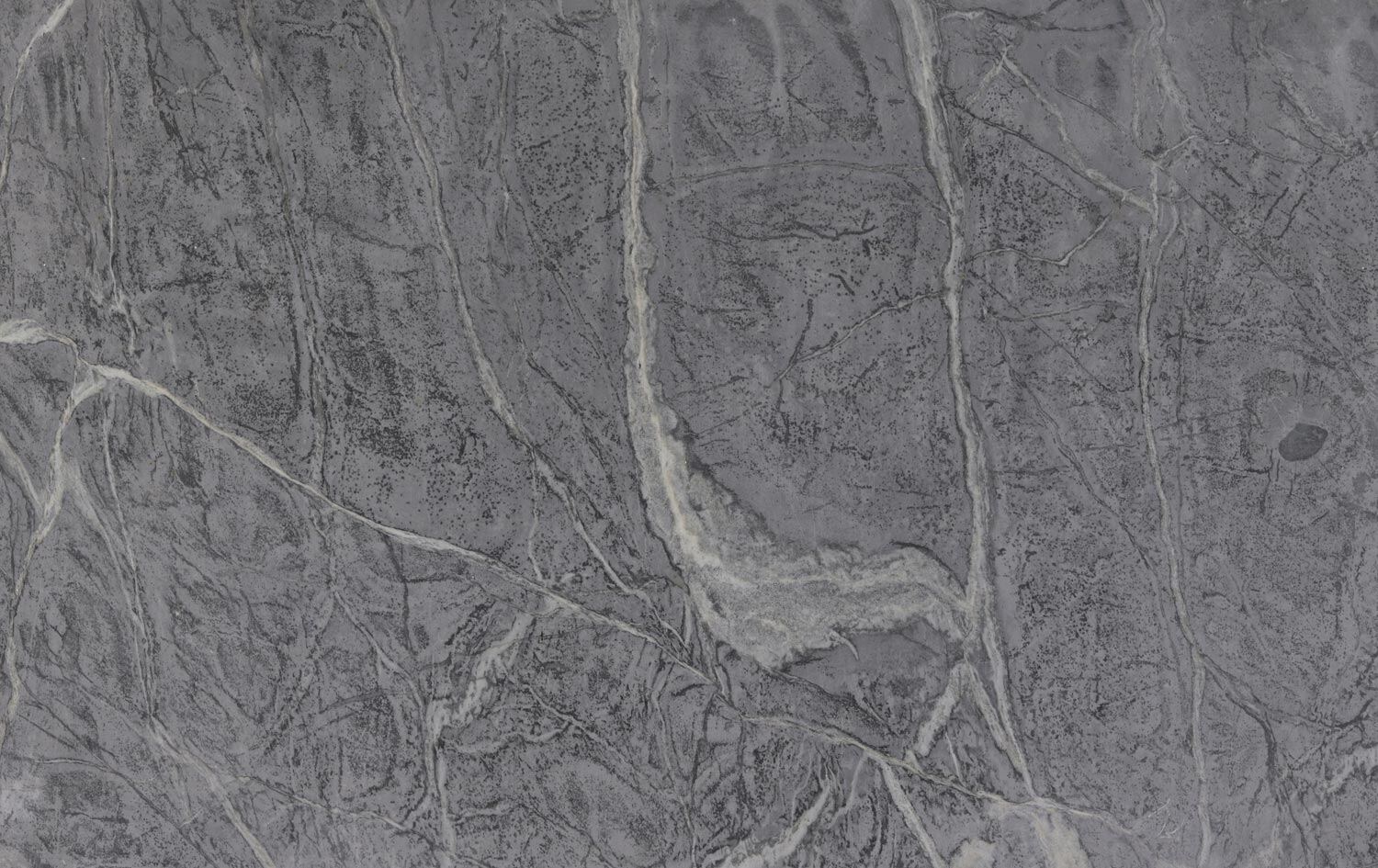 Soapstone Barroca countertops in light gray with flowing organic veining, ideal for kitchen countertops. Soapstone by Granite Guy Inc.