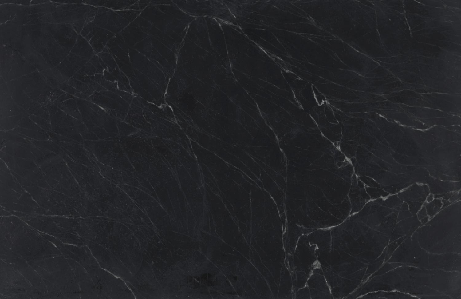 Soapstone Ouro Preto countertops in deep black with subtle white veining, great for kitchen countertops. Soapstone by Granite Guy Inc.