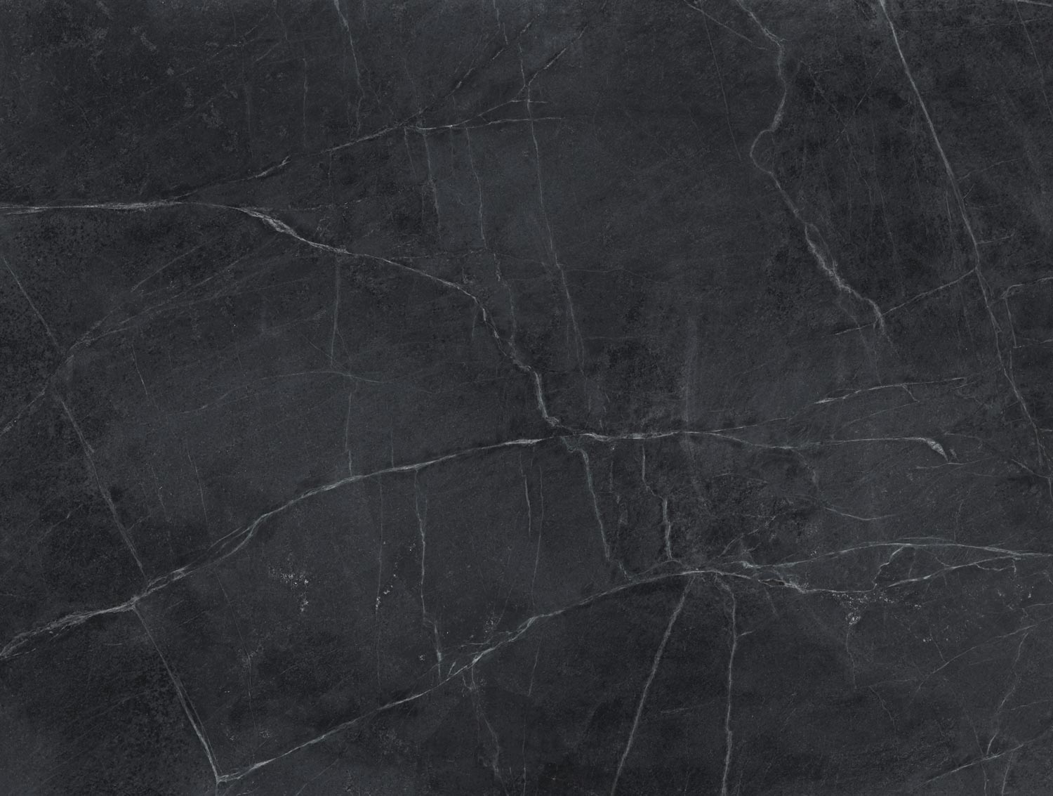 Soapstone Santa Barbara countertops in a rich black tone with bold white veining, ideal for kitchen countertops. Soapstone by Granite Guy Inc.