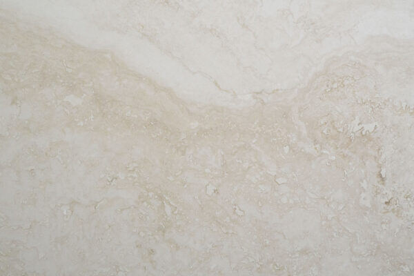 Travertine Bianco Santa Caterina countertops with creamy white and ivory swirls, ideal for kitchen countertops. Travertine by Granite Guy Inc.