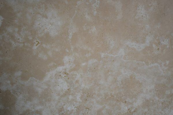 Travertine Classic Light Vein Cut countertops with soft beige layers and natural pores, ideal for kitchen countertops. Travertine by Granite Guy Inc.