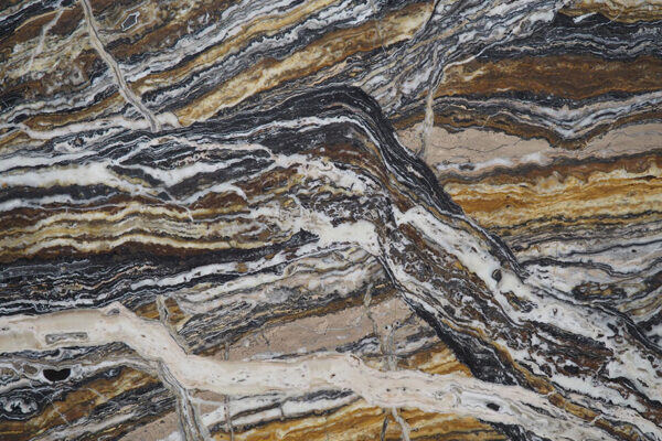 Travertine Jurassico Scurro countertops with bold black, gold, and beige veining, ideal for kitchen countertops. Travertine by Granite Guy Inc.