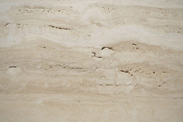 Travertine Navona V-Cut Unfilled countertops with warm beige tones and raw texture, great for kitchen countertops. Travertine by Granite Guy Inc.