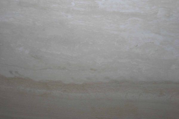 Travertine Osso vein cut countertops with soft cream and ivory bands, great for kitchen countertops or bathroom vanities. Travertine by Granite Guy Inc.