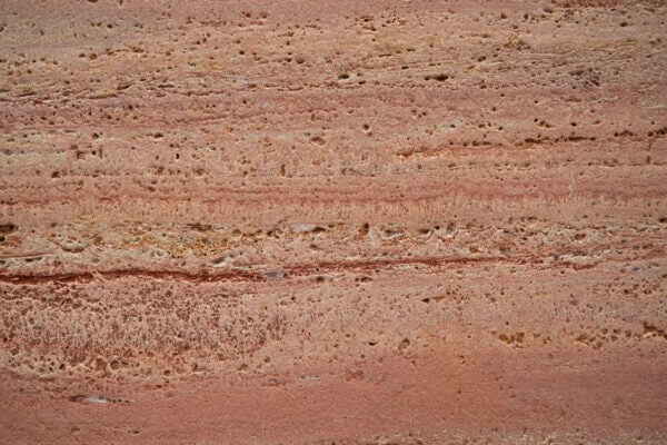 Travertine Red Dusted countertops with soft coral and peach layers, ideal for kitchen countertops or vanities. Travertine by Granite Guy Inc.