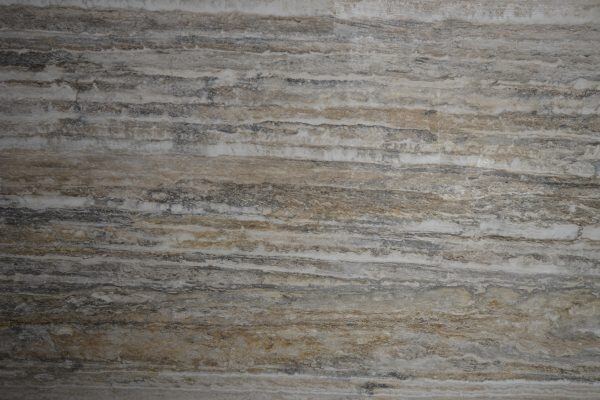Travertine Roma Silver countertops with streaked gray and beige tones, great for kitchen countertops or showers. Travertine by Granite Guy Inc.