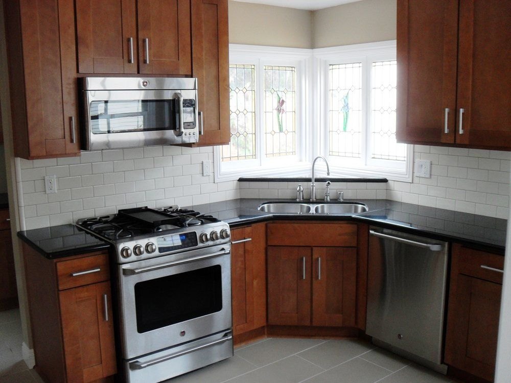 Absolute Black granite kitchen countertops with cherry cabinets in a Massachusetts home