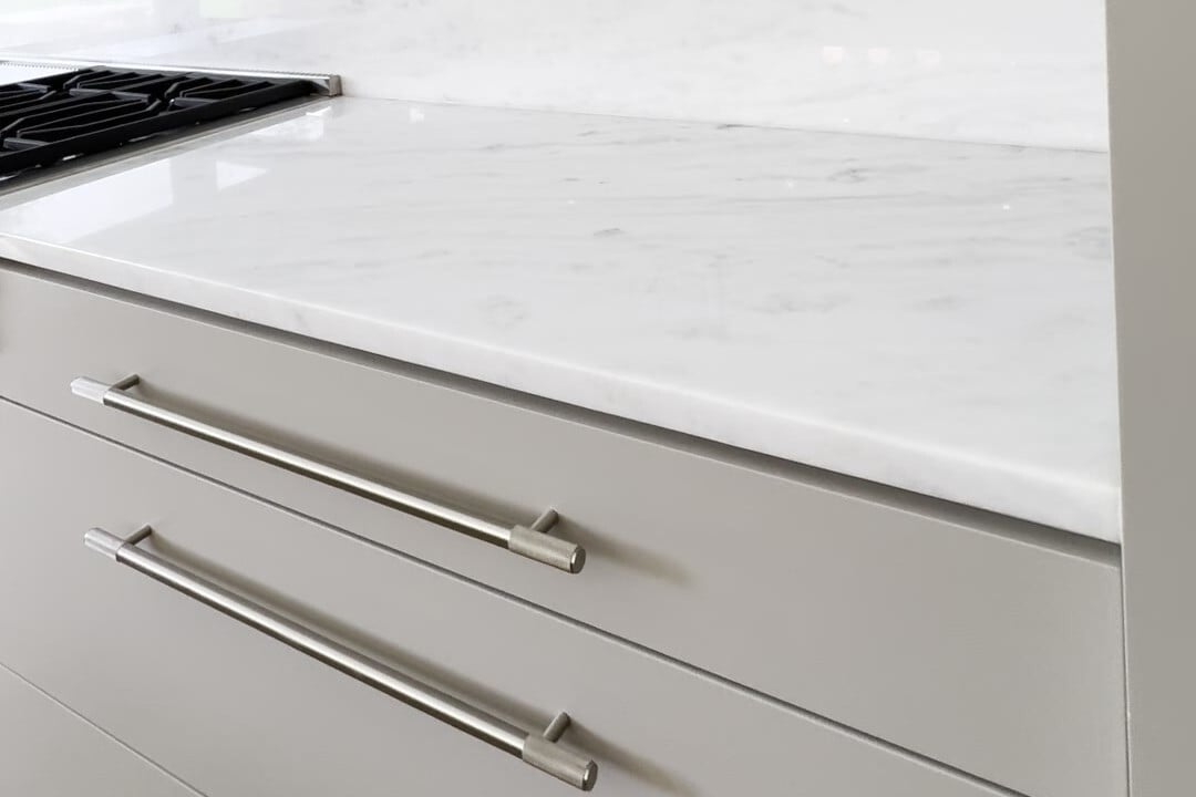 Close view of an eased edge countertop in Pegasus White marble, Lexington, Massachusetts
