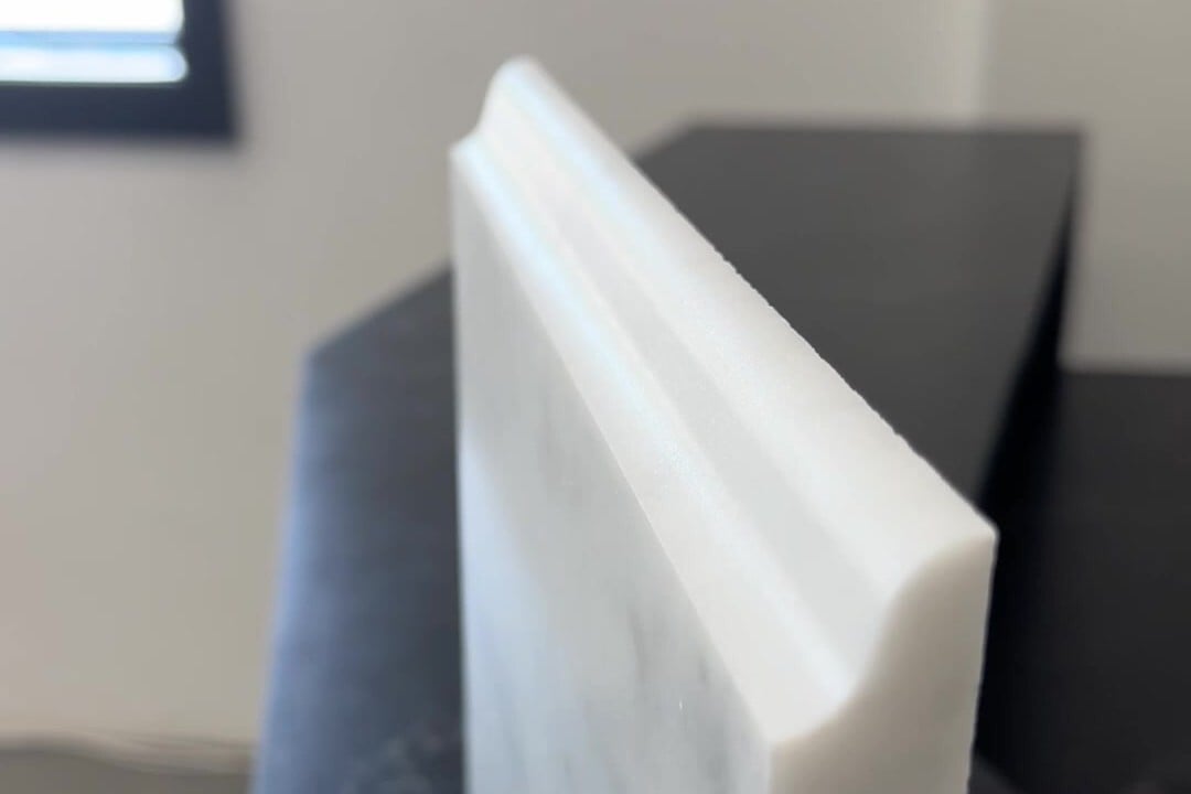 Ogee edge profile on a White Carrara marble sample at our Southborough, Massachusetts showroom