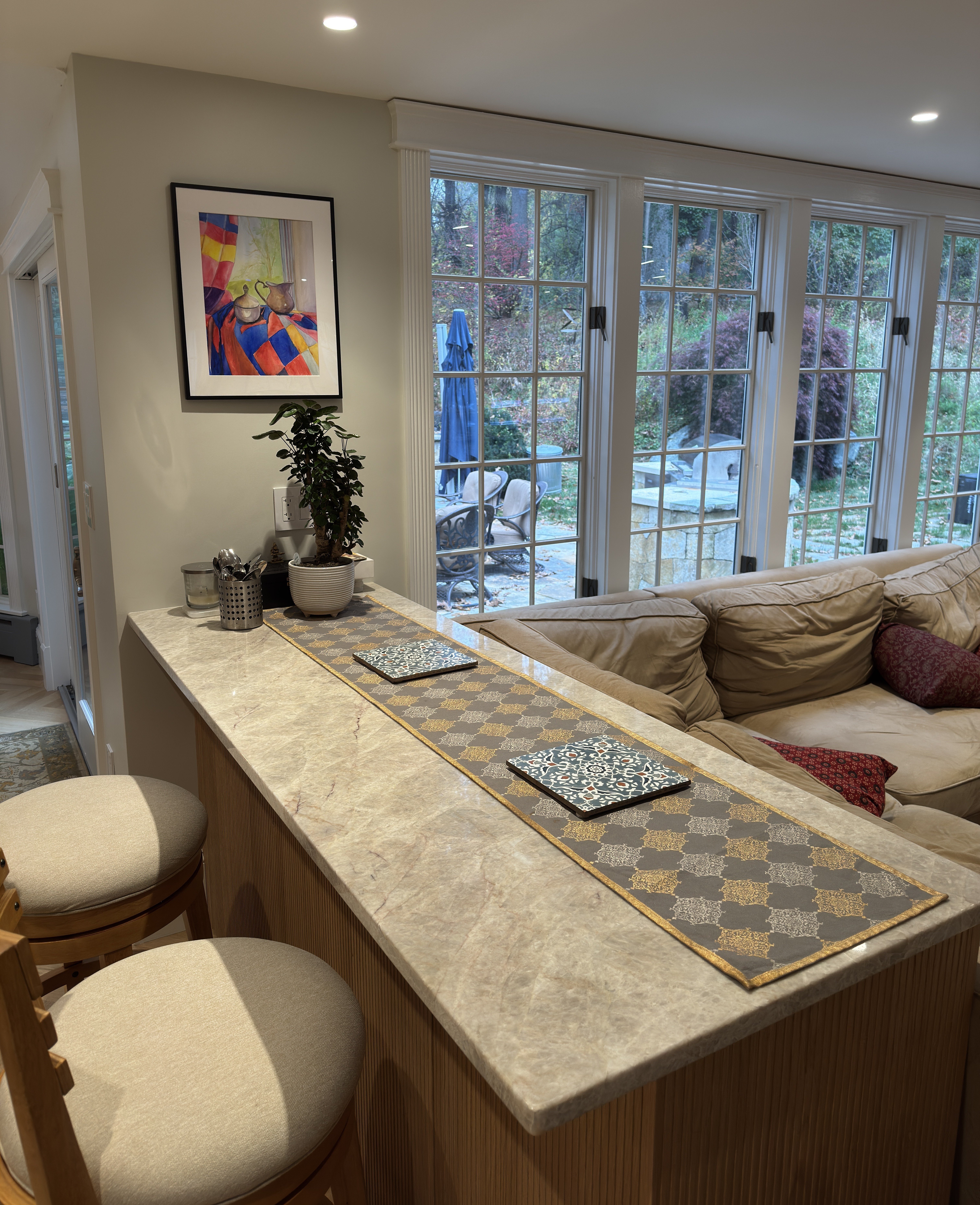 Taj Mahal quartzite kitchen peninsula countertops fabricated and installed by Granite Guy Inc. in MetroWest Massachusetts
